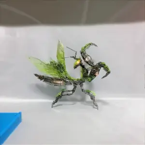 Mechanical praying mantis model in lightbox